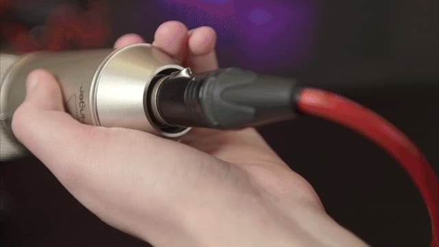 Image shows an XLR cable plugged into the back of a Behringer B-1 Condenser Mic.
