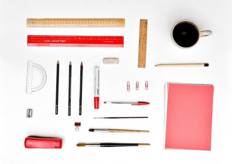 This is an image of hyper-organised stationery in red and white. It is neat and pristine.