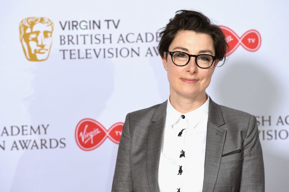 A photo of Sue Perkins smiling towards the camera at the BAFTA awards.
