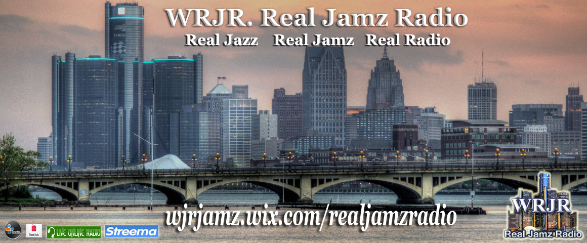 This is an image of Chicago. There are multiple skyscrapers, and orangey dusk sky, and a bridge going across the centre of the image. At the top it reads WRJR Real Jamz Radio, and below are links to the radio station.