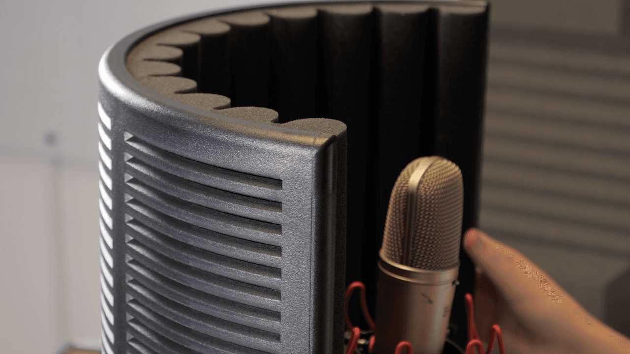 Image shows the sE Electronics Reflection Filter X Vocal Booth, surrounding a microphone.