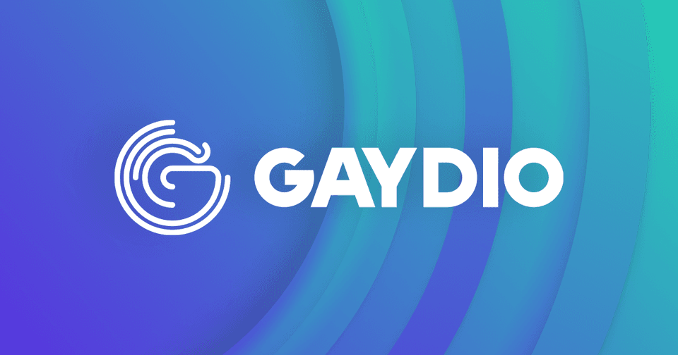 The logo for radio station, Gaydio. There is a blue background and Gaydio is in white text in the centre.
